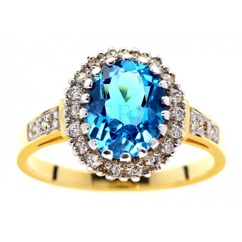 Królewski, złoty pierścionek z topazem blue i brylantami o łącznej masie 0.30 ct