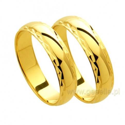 Delikatne obrączki ślubne z klasycznego złota z ozdobnymi krawędziami