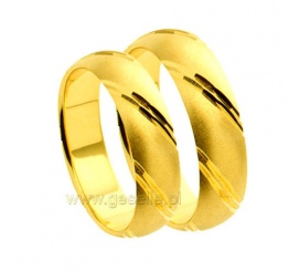 Delikatne obrączki ślubne z żółtego złota z lśniącymi zdobieniami