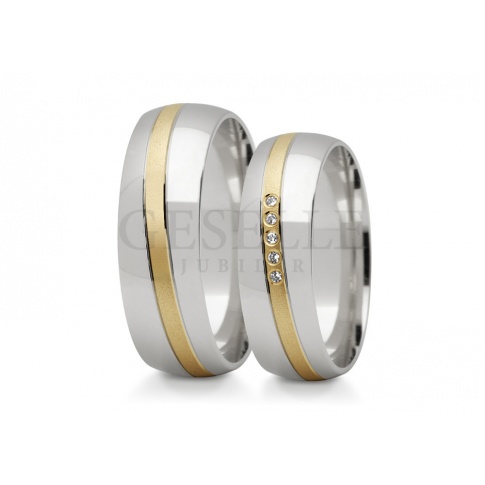 Niebanalne, dwukolorowe złote obrączki ślubne z wspaniałą wstęgą kamieni - cyrkonii lub brylantów
